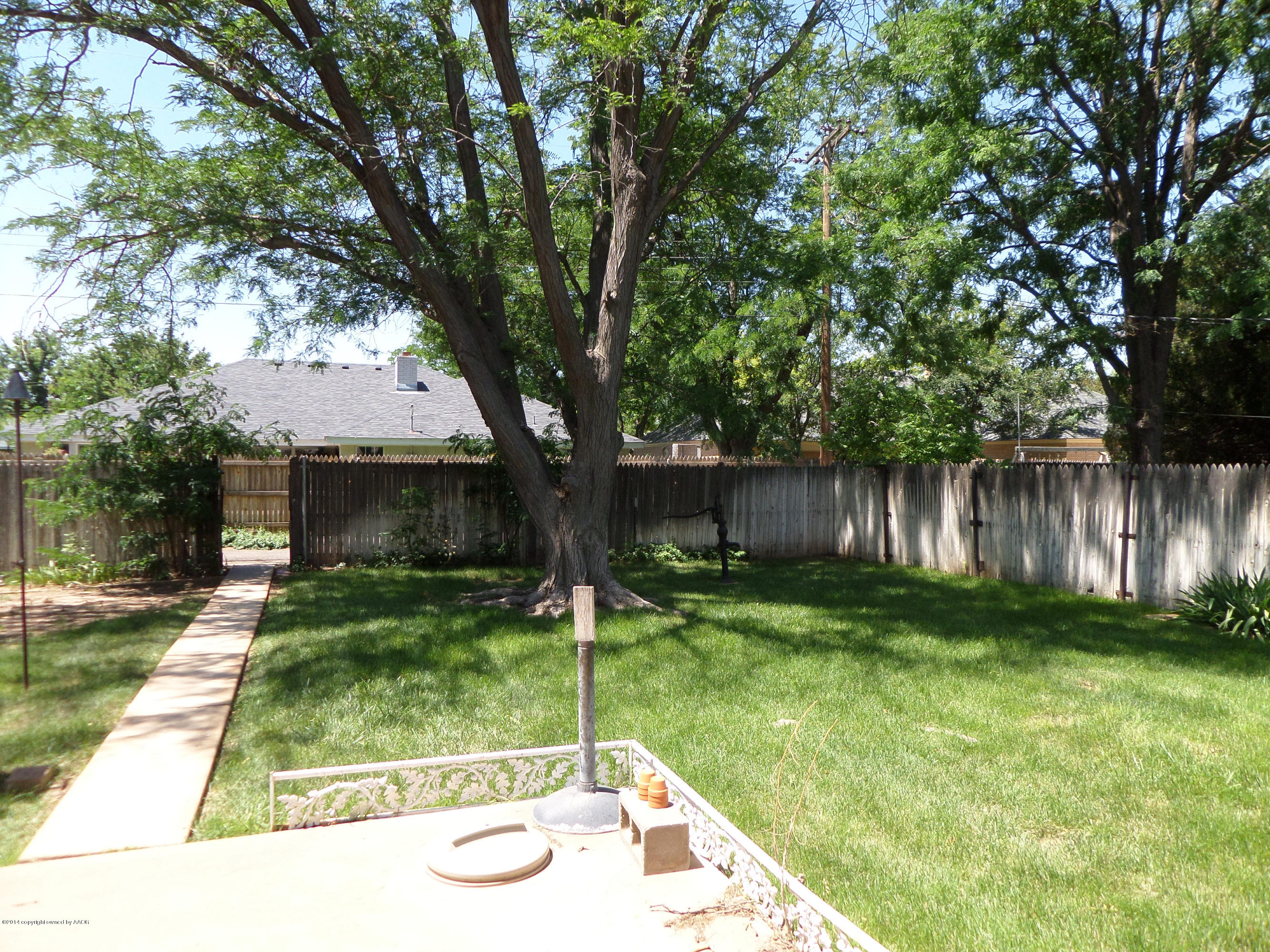 6911 Calumet Road Amarillo, TX 79106 - Photo 7 of 8 a view of backyard with plants and outdoor seating