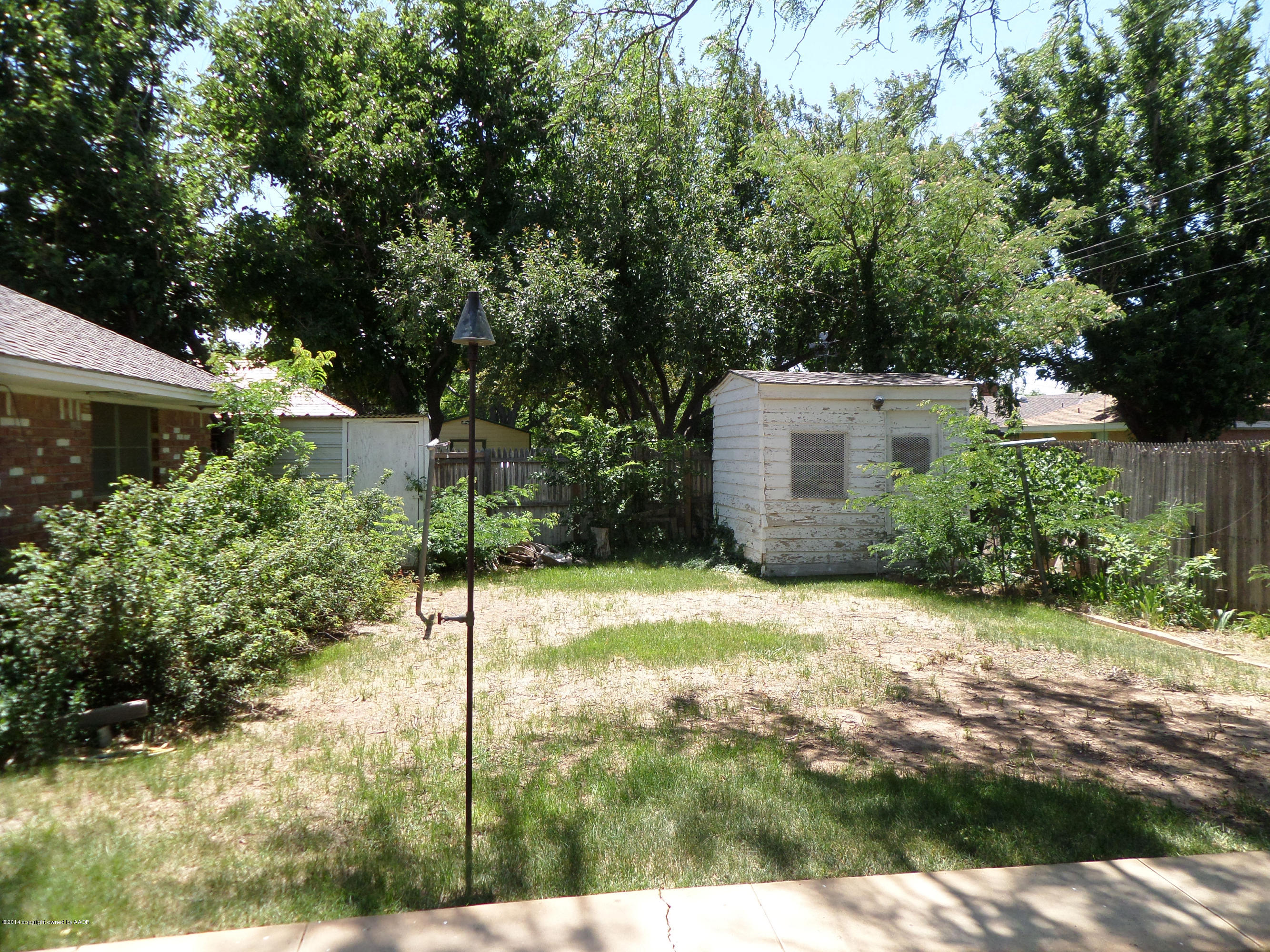 6911 Calumet Road Amarillo, TX 79106 - Photo 8 of 8 a view of a back yard