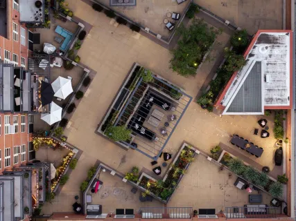 an aerial view of a building with lots of trees