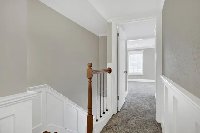 a view of a hallway with white walls