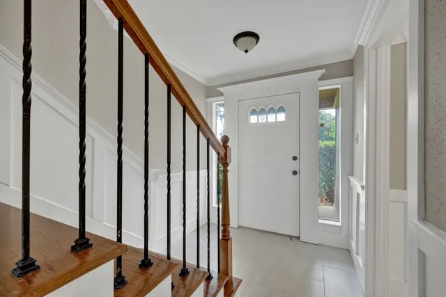 a view of a hallway with a door and a window