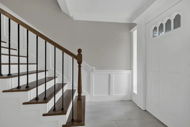 a view of an entryway with a hallway