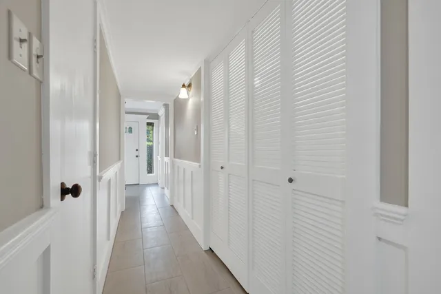 a view of a hallway with a wooden floor