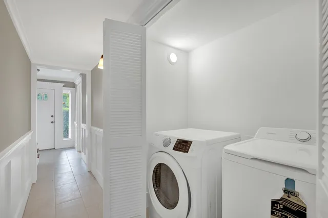 a view of a hallway with washer and dryer