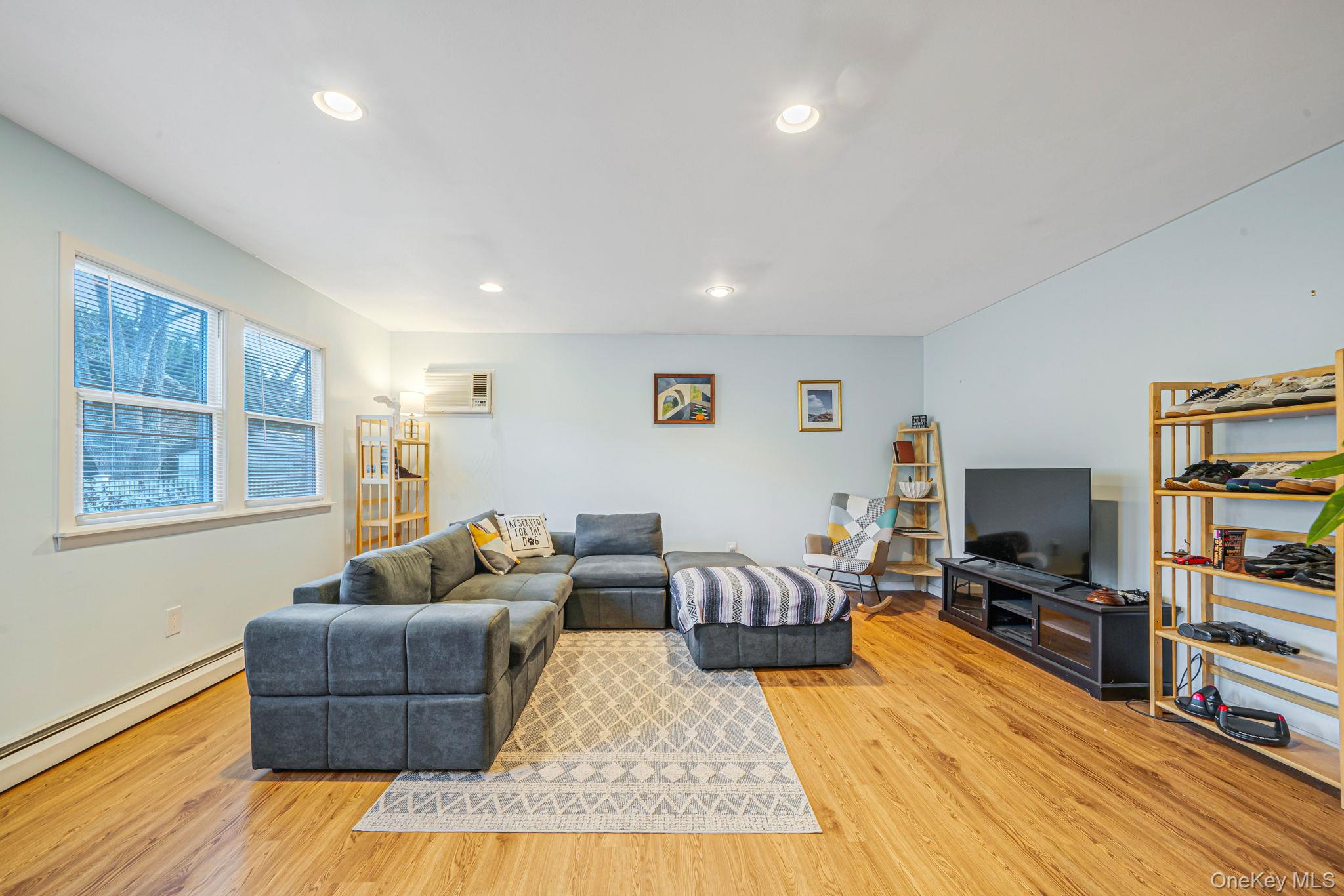 39 Kay Road Calverton, NY 11933 - Photo 4 of 17 Living area with light wood-style floors and recessed lighting