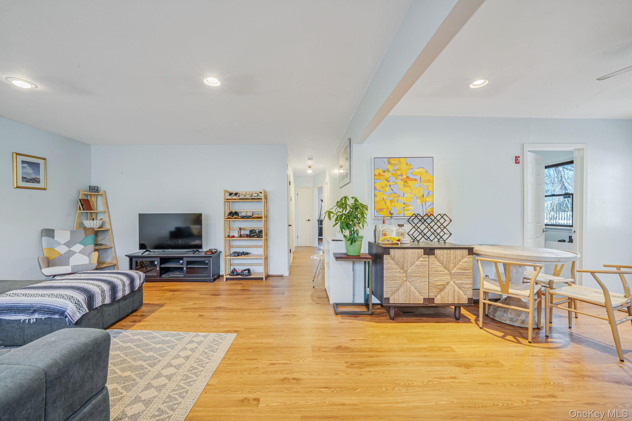 39 Kay Road Calverton, NY 11933 - Photo 9 of 17 Living room with light wood-style flooring and recessed lighting