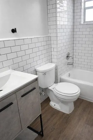 a bathroom with a toilet a sink and a bathtub