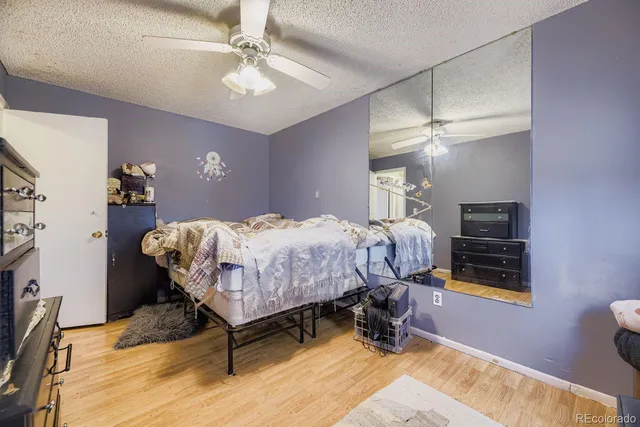 a bed room with a bed and a chandelier