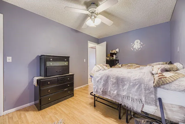 a bedroom with a bed and dresser