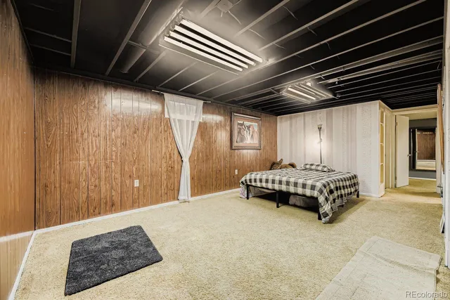 a spacious bedroom with a bed and a shower