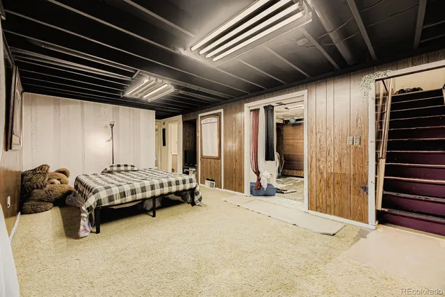 a bedroom with furniture and a window