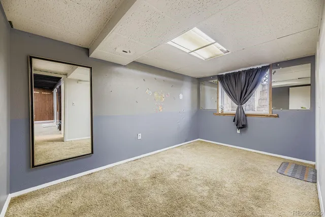 a bathroom with a sink toilet and a mirror