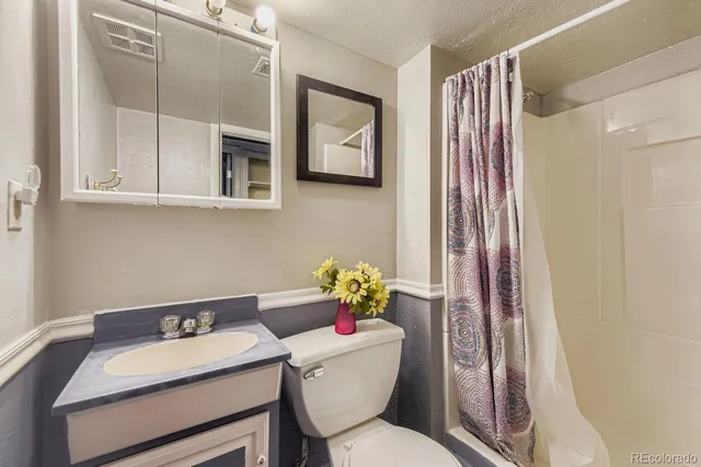 a view of a patio with a table and chairs