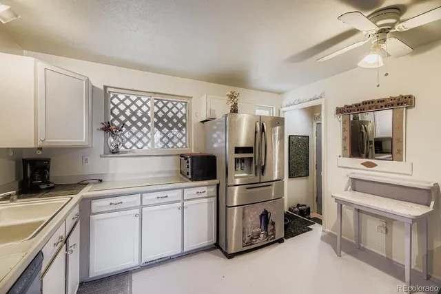 a kitchen with cabinets and stainless steel appliances