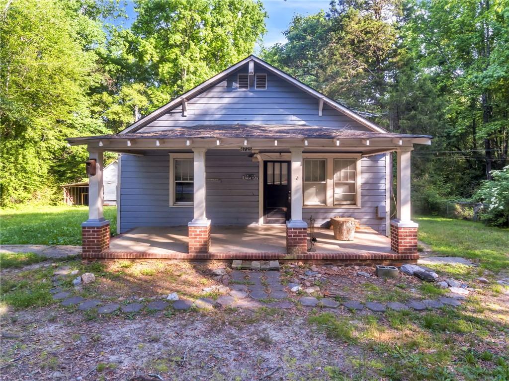 4725 Old Douglasville Road Lithia Springs, GA 30122 - Photo 1 of 1 a front view of a house with garden