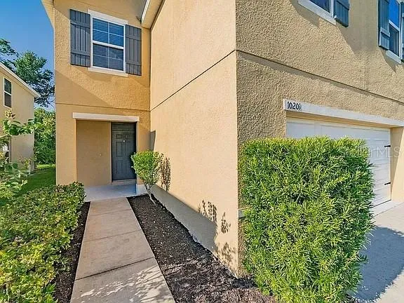 a view of a pathway with a house in the background