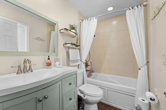 a bathroom with a sink a toilet and a bathtub