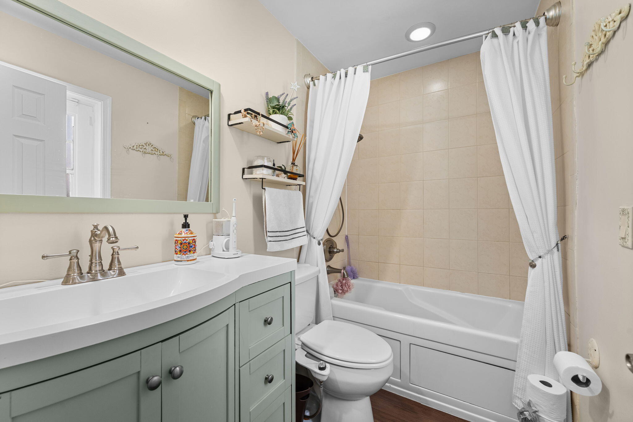 2529 Northwest 32nd Street Boca Raton, FL 33434 - Photo 11 of 19 a bathroom with a sink a toilet and a bathtub