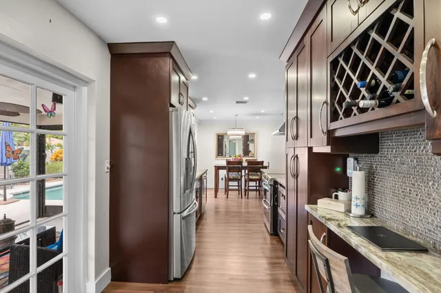a view of a kitchen with dining table and chairs