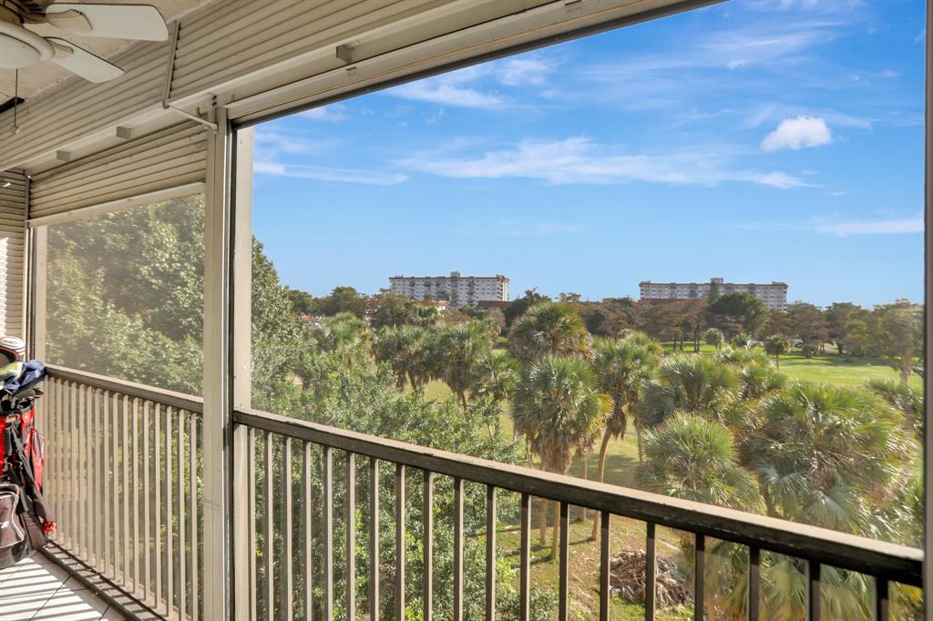 5570 Northwest 44th Street, Unit 518A Tamarac, FL 33319 - Photo 13 of 28 a view of a city from a balcony