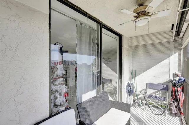 a view of a room with a glass door