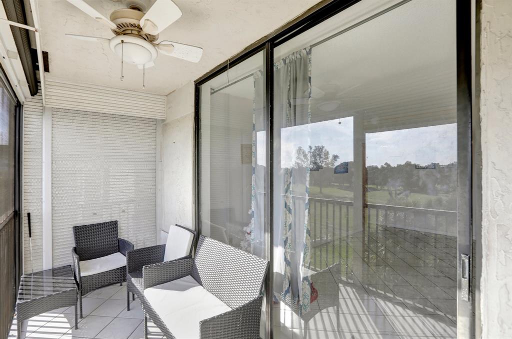 5570 Northwest 44th Street, Unit 518A Tamarac, FL 33319 - Photo 16 of 28 a view of a room with a glass door