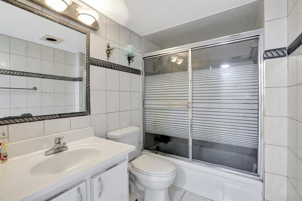 5570 Northwest 44th Street, Unit 518A Tamarac, FL 33319 - Photo 19 of 28 a bathroom with a sink toilet and shower