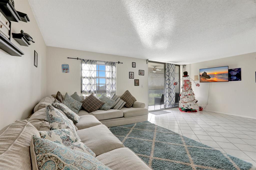 5570 Northwest 44th Street, Unit 518A Tamarac, FL 33319 - Photo 10 of 28 a living room with furniture and a window