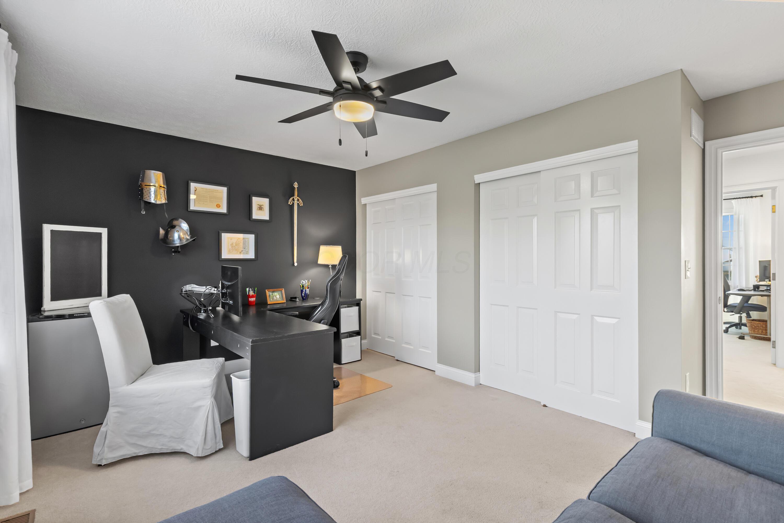 1364 Dale Ford Road Delaware, OH 43015 - Photo 64 of 112 • Light sand carpet • Black & grey painted walls • Lighted ceiling fan • (2) sets of closets with double sliding doors • Wall hooks do not remain • Jack & Jill bath access • Drapes remain