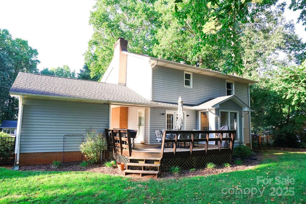1209 Derbyshire Road Kannapolis, NC 28081 - Photo 16 of 19 a view of a house with a yard porch and sitting area