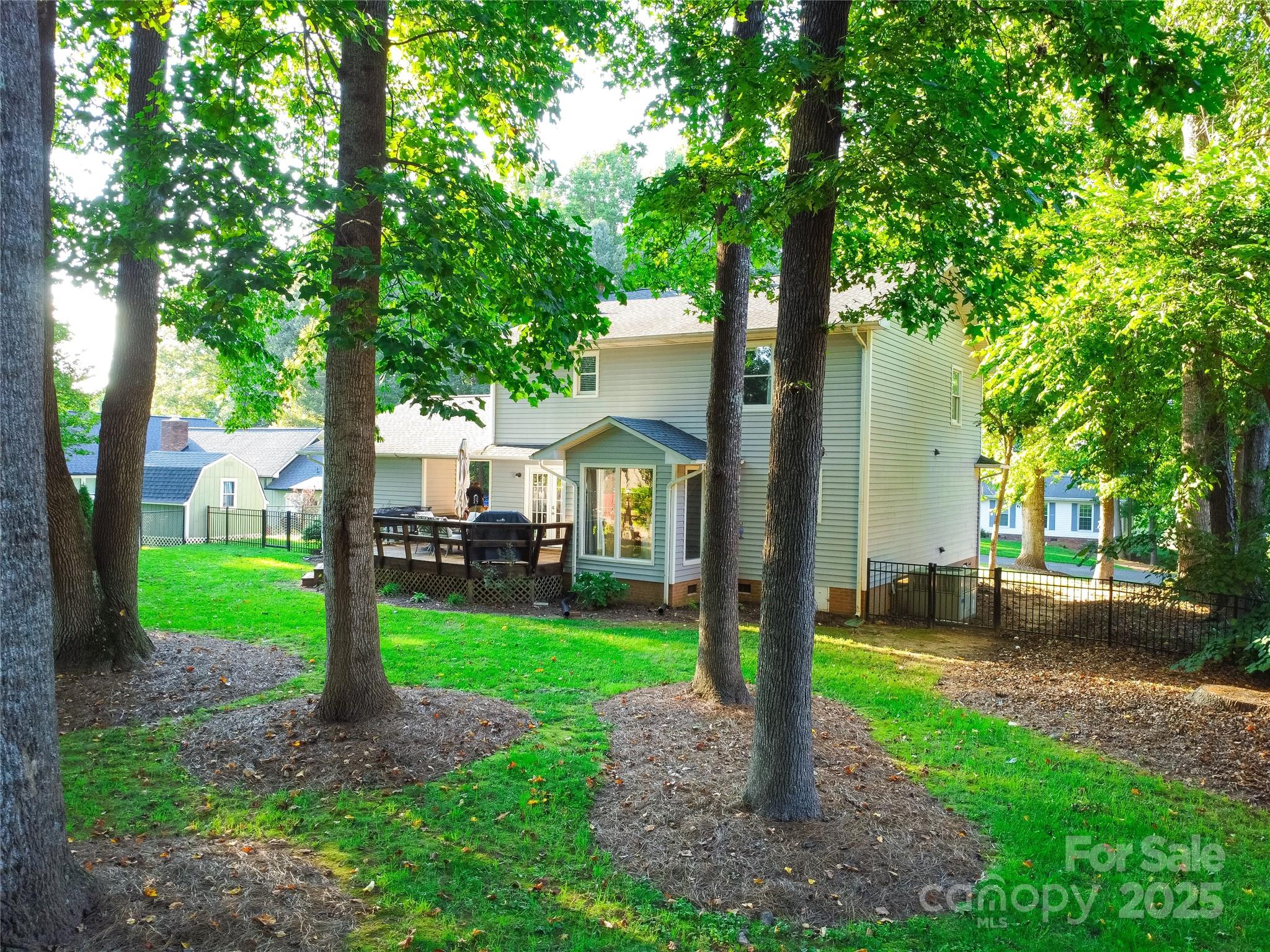 1209 Derbyshire Road Kannapolis, NC 28081 - Photo 17 of 19 a front view of a house with garden and trees