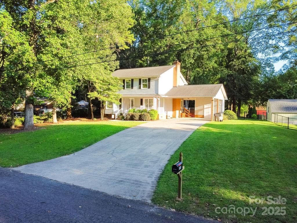 1209 Derbyshire Road Kannapolis, NC 28081 - Photo 2 of 19 a front view of house with yard and green space