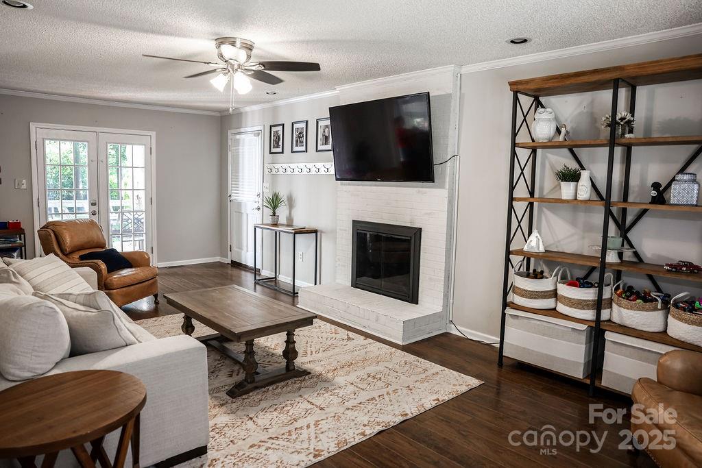 1209 Derbyshire Road Kannapolis, NC 28081 - Photo 3 of 19 a living room with furniture and a fireplace