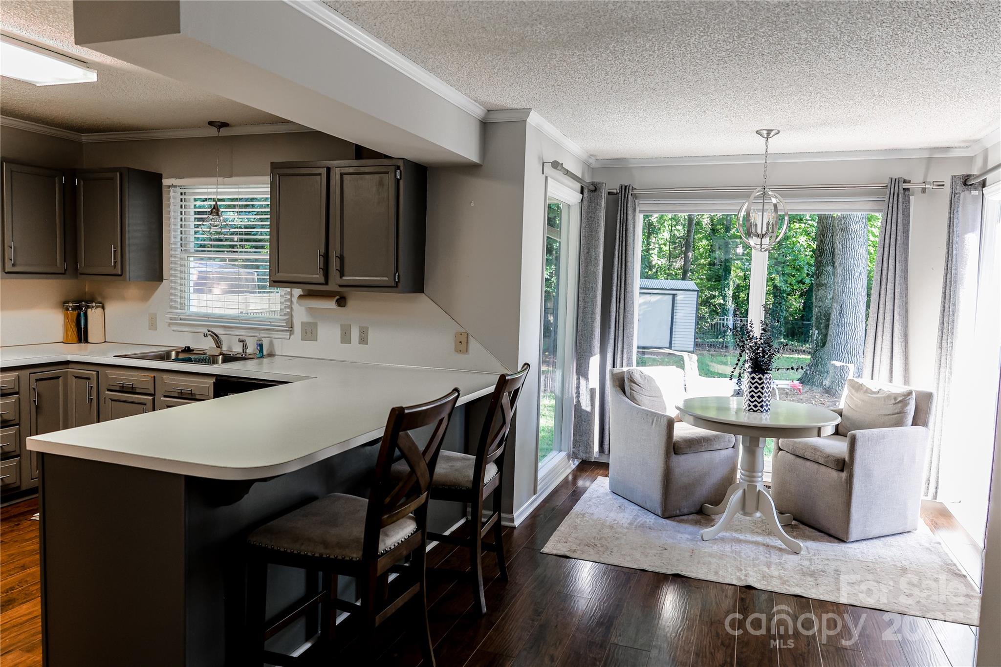 1209 Derbyshire Road Kannapolis, NC 28081 - Photo 7 of 19 a view of a dining room with furniture window and outside view