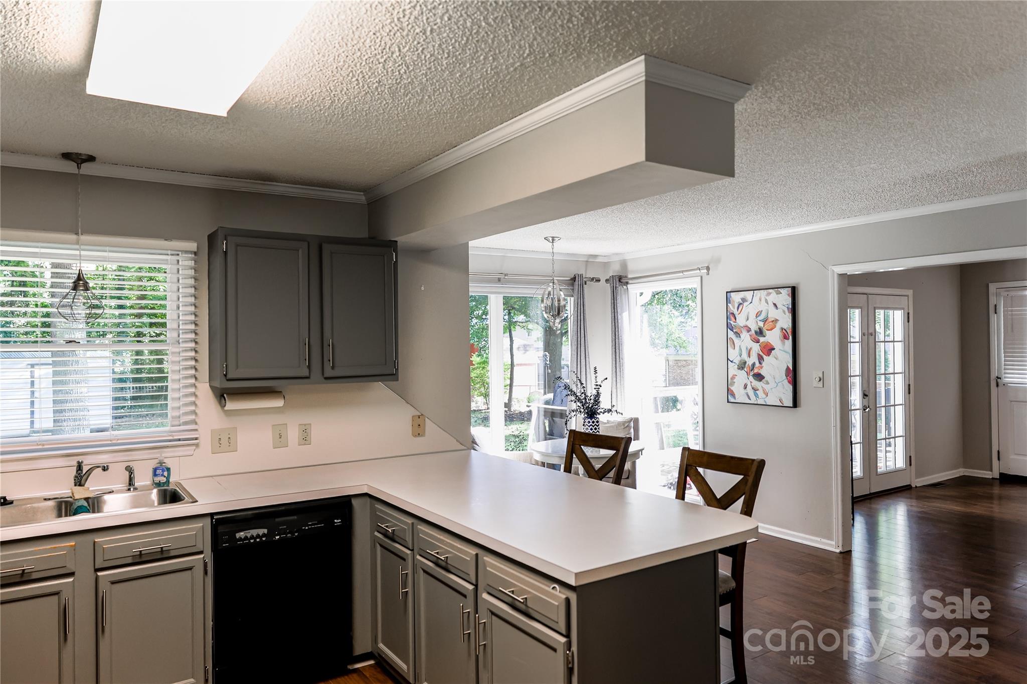 1209 Derbyshire Road Kannapolis, NC 28081 - Photo 8 of 19 a kitchen with a sink a stove a refrigerator and cabinets
