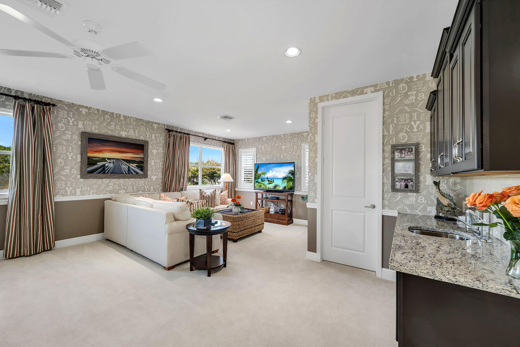 3783 Canopy Circle Naples, FL 34120 - Photo 14 of 39 a living room with furniture and a flat screen tv