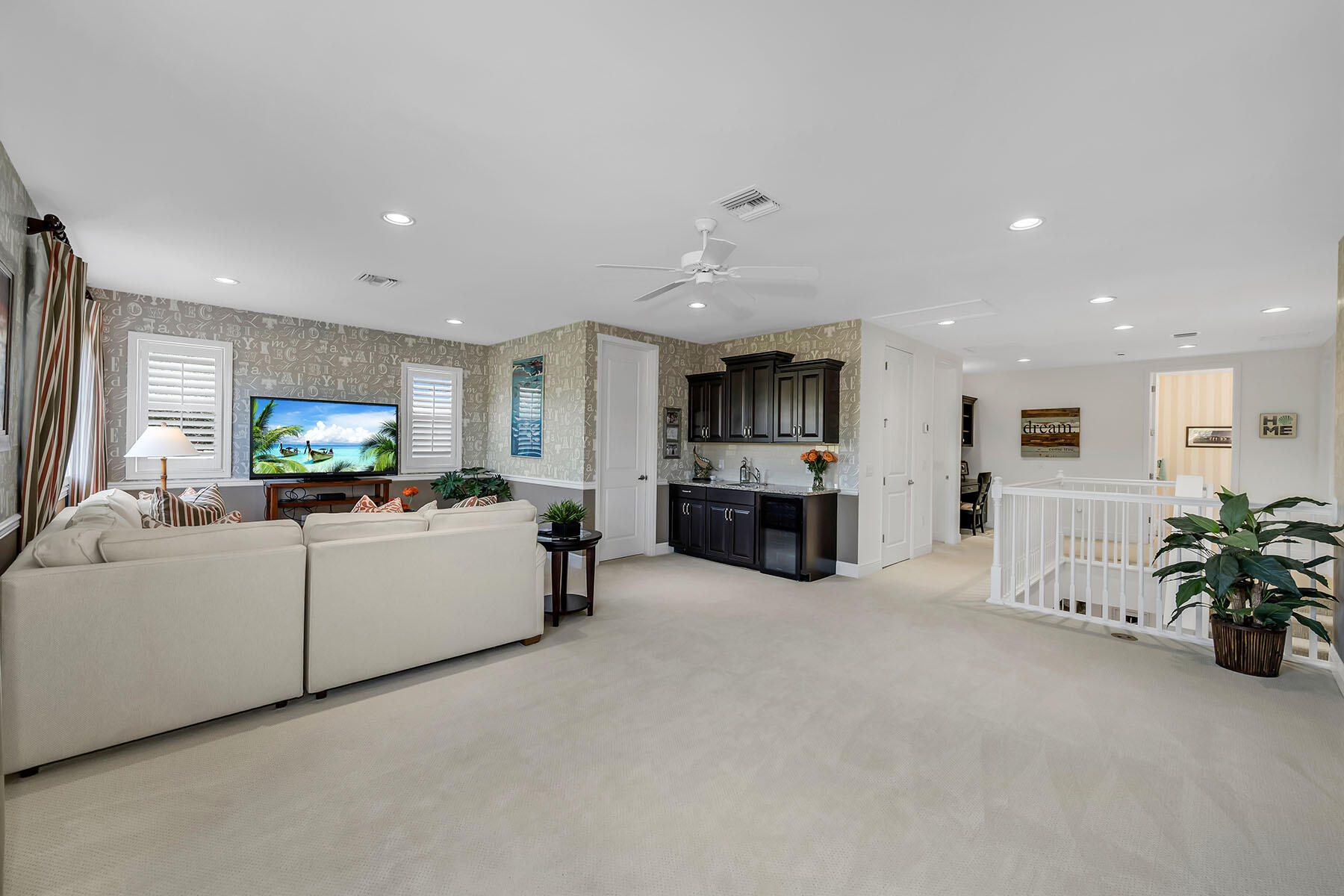 3783 Canopy Circle Naples, FL 34120 - Photo 16 of 39 a living room with furniture and a flat screen tv
