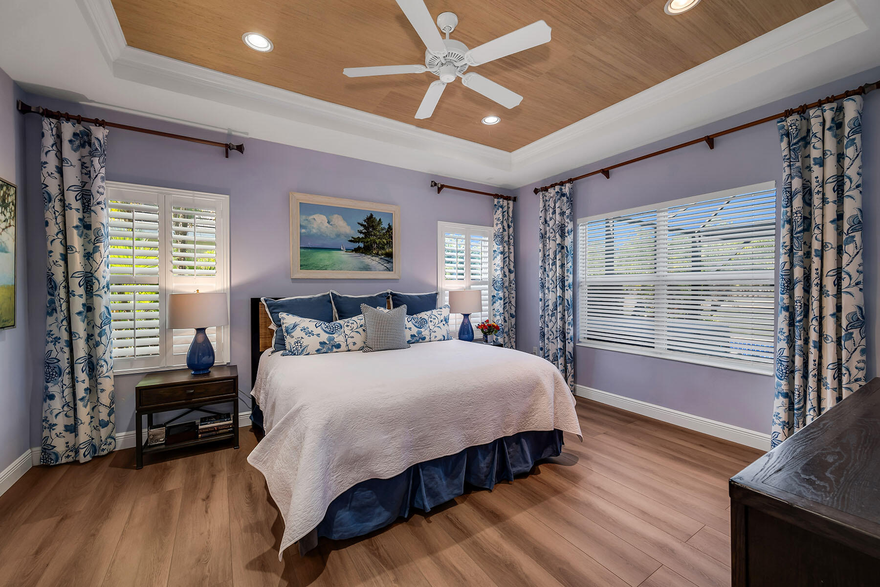 3783 Canopy Circle Naples, FL 34120 - Photo 17 of 39 a bedroom with a large bed and a tv