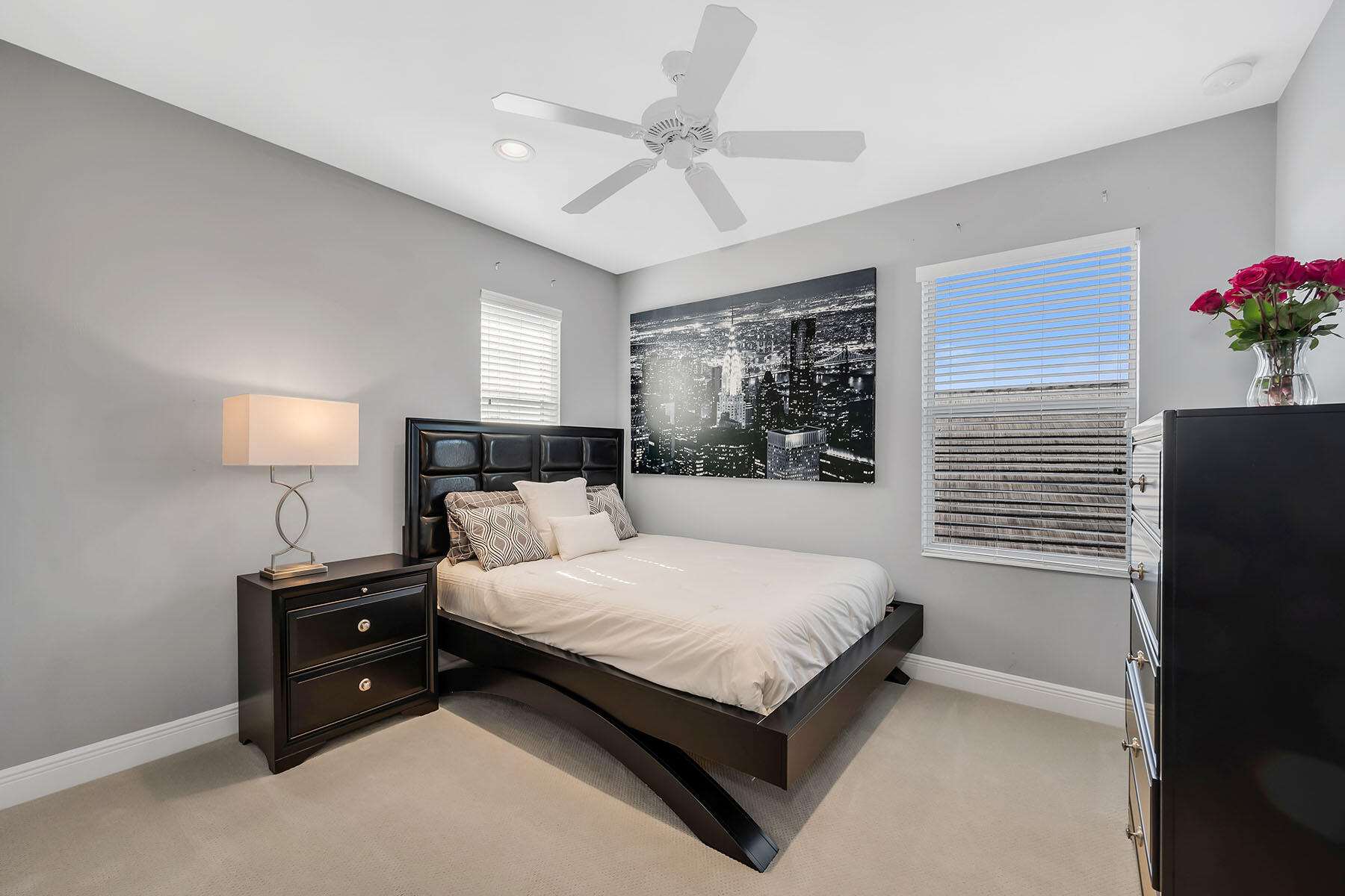 3783 Canopy Circle Naples, FL 34120 - Photo 19 of 39 a bedroom with a bed and a potted plant