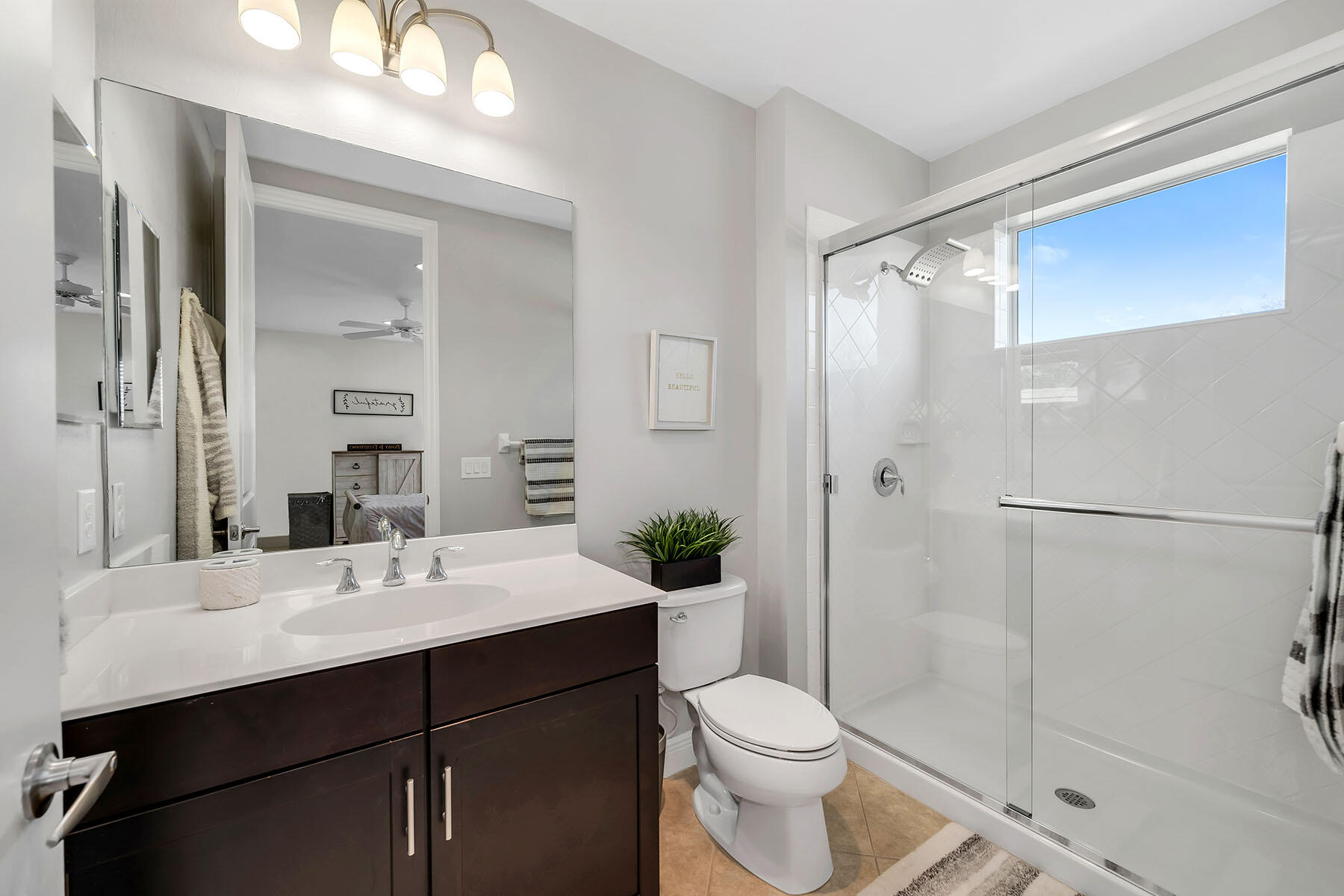 3783 Canopy Circle Naples, FL 34120 - Photo 20 of 39 a bathroom with a sink a toilet and shower