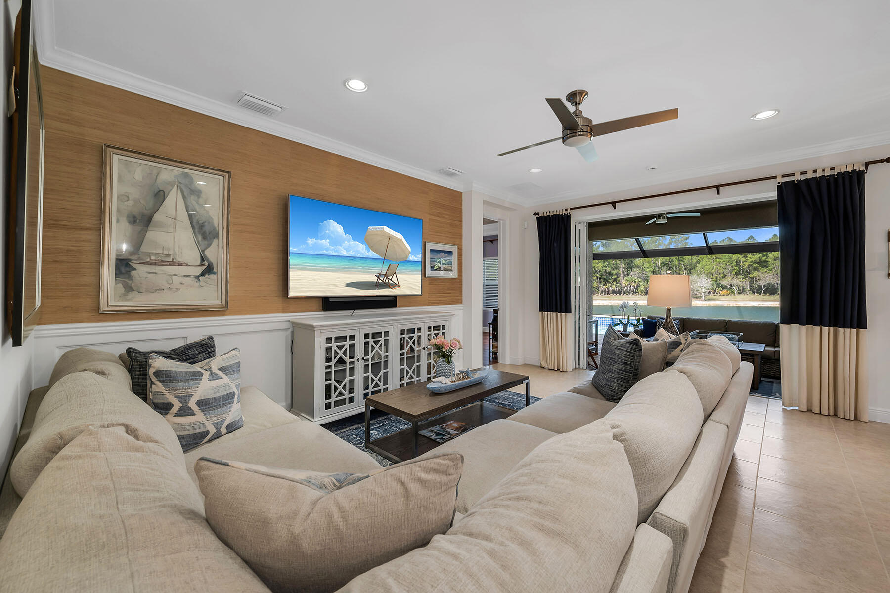 3783 Canopy Circle Naples, FL 34120 - Photo 2 of 39 a living room with furniture and a flat screen tv