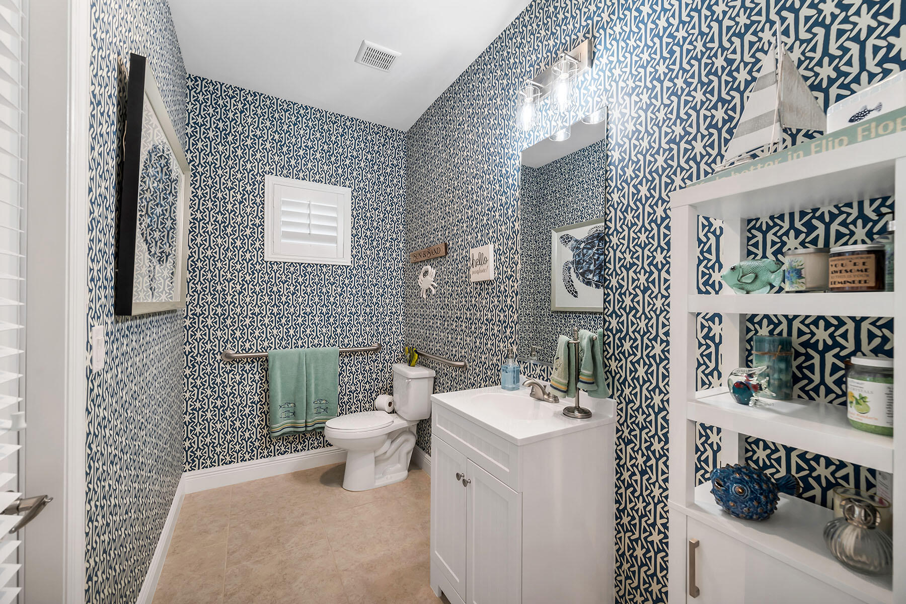 3783 Canopy Circle Naples, FL 34120 - Photo 24 of 39 a bathroom with a sink a toilet and mirror