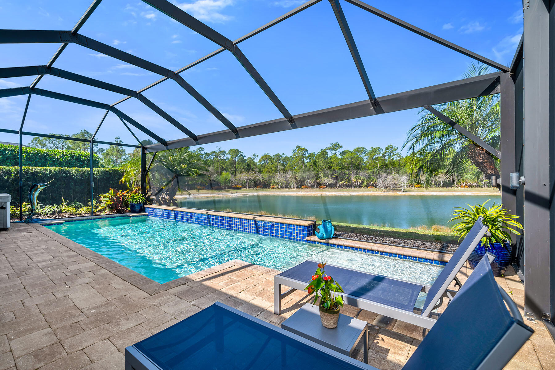 3783 Canopy Circle Naples, FL 34120 - Photo 28 of 39 a view of a two chairs in the patio