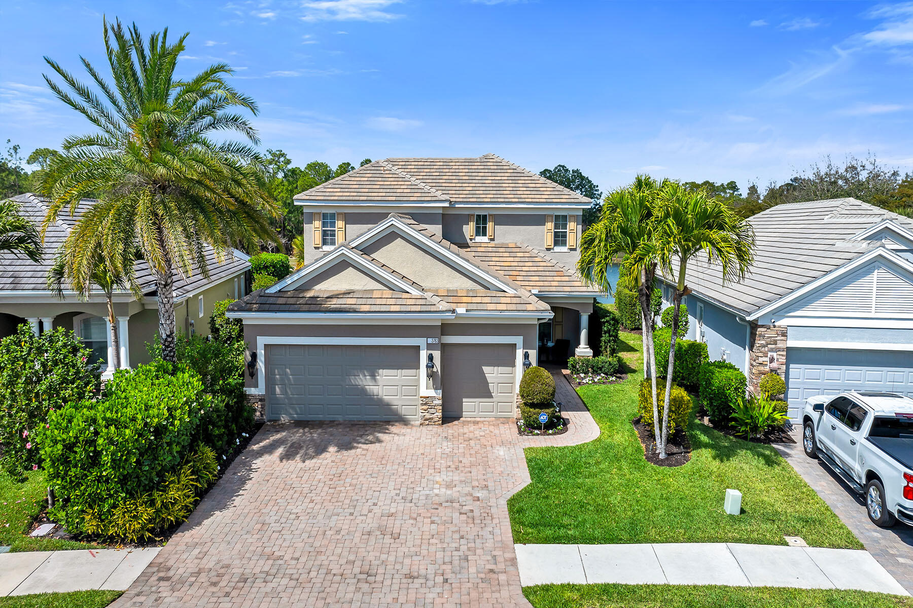 3783 Canopy Circle Naples, FL 34120 - Photo 30 of 39 a front view of a house with garden