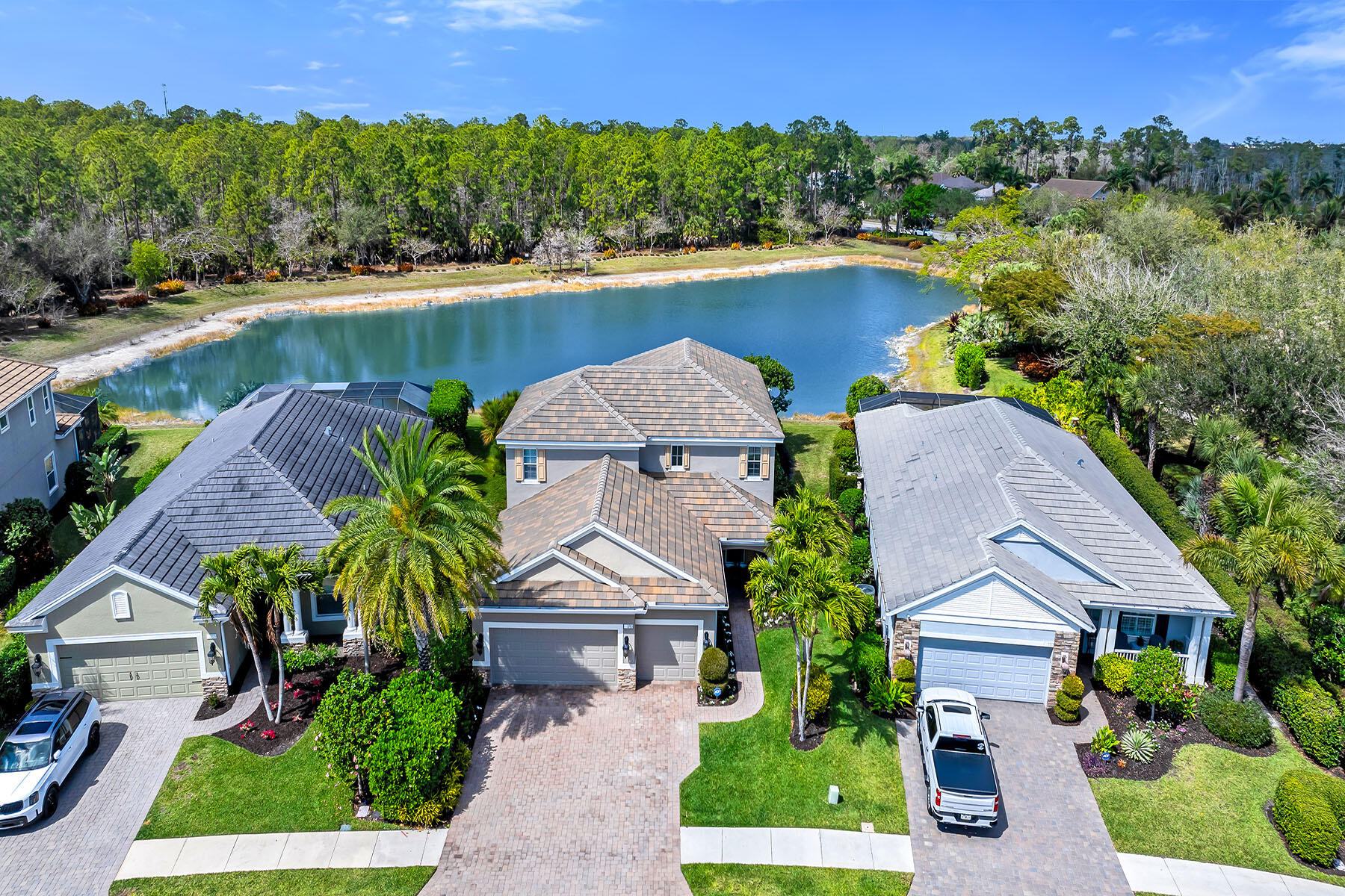 3783 Canopy Circle Naples, FL 34120 - Photo 31 of 39 an aerial view of a house with a garden and lake view