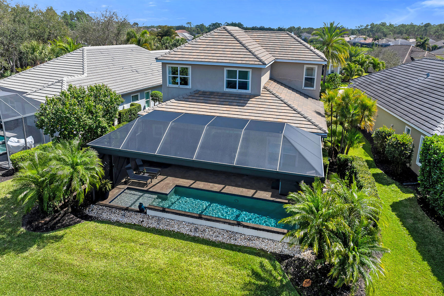 3783 Canopy Circle Naples, FL 34120 - Photo 35 of 39 a front view of a house with a yard