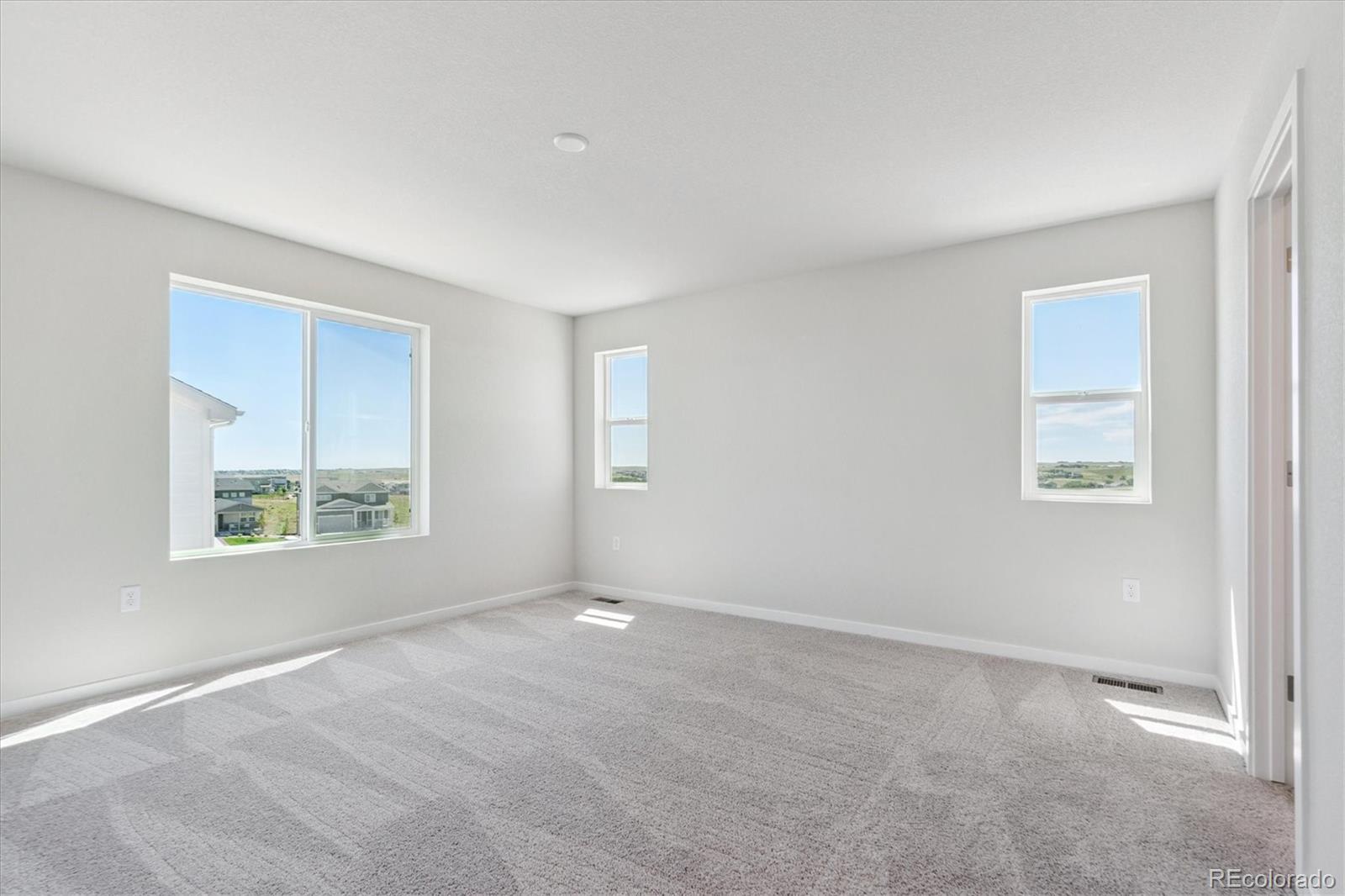 4235 Gozzer Ranch Drive Elizabeth, CO 80107 - Photo 17 of 23 a view of an empty room with a window