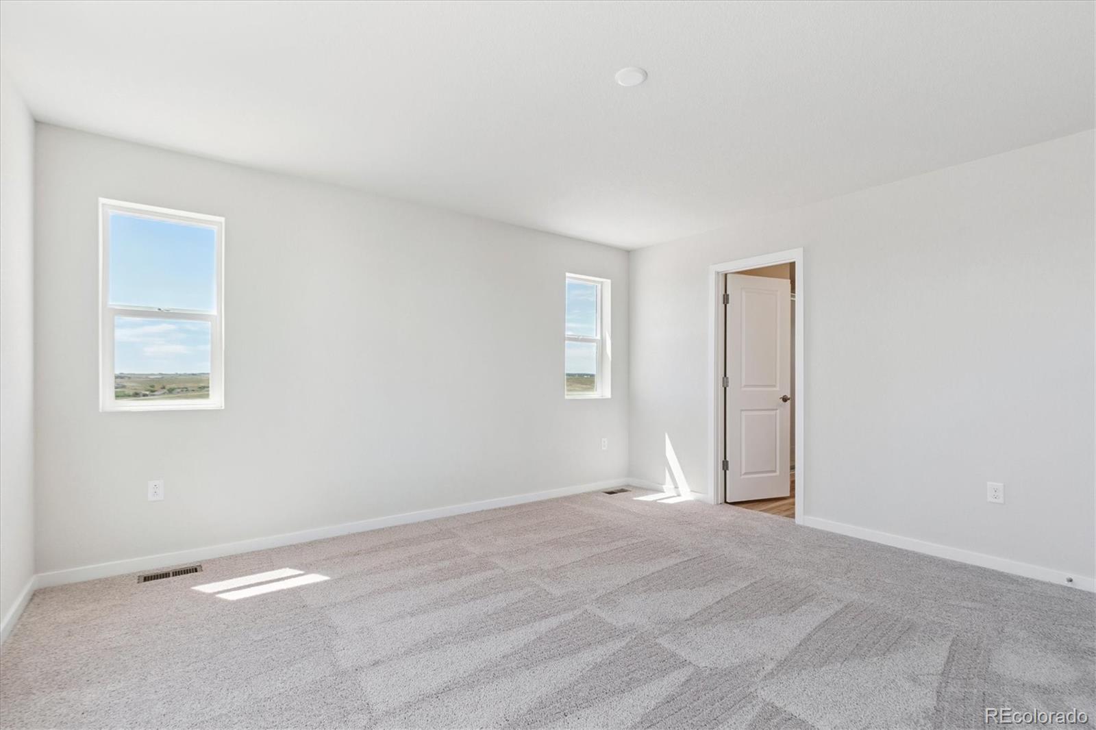 4235 Gozzer Ranch Drive Elizabeth, CO 80107 - Photo 18 of 23 a view of an empty room with a window