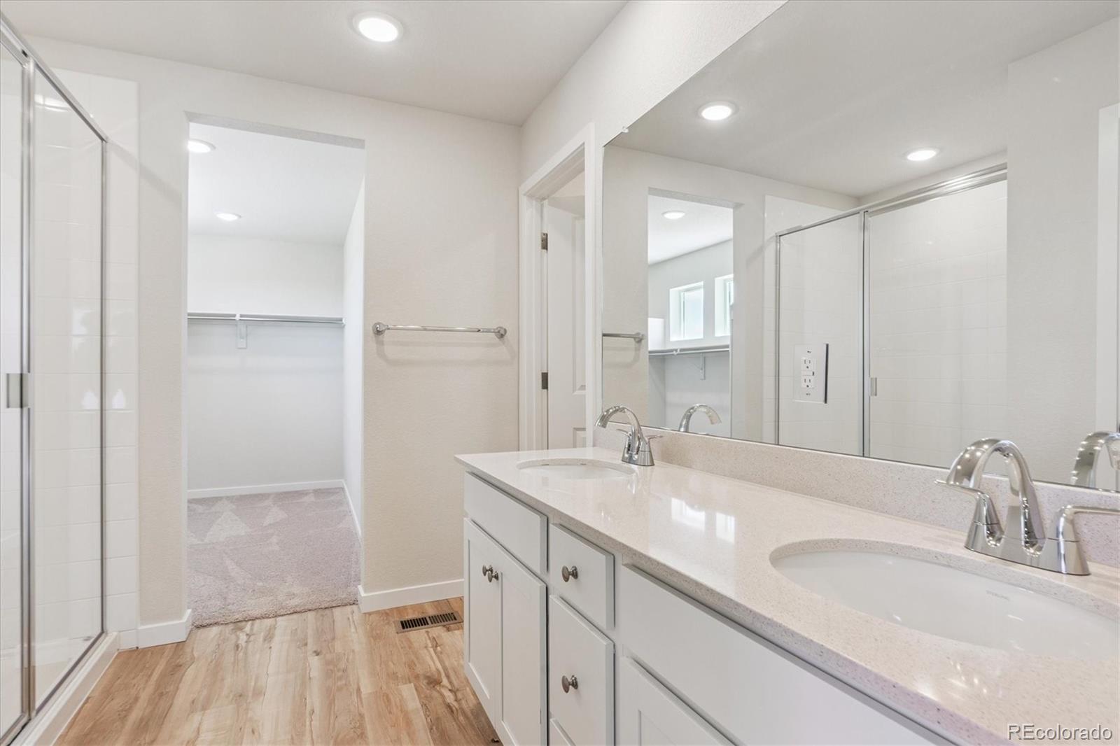 4235 Gozzer Ranch Drive Elizabeth, CO 80107 - Photo 19 of 23 a bathroom with a sink and a mirror