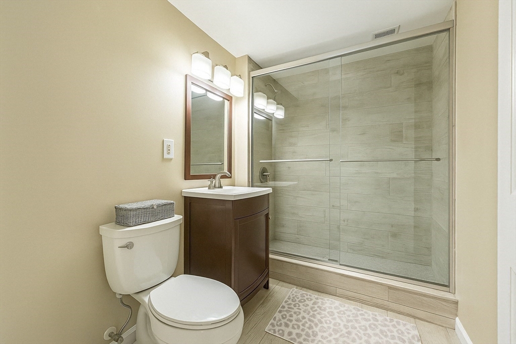 466 Commonwealth Avenue, Unit 301 Boston, MA 02215 - Photo 8 of 14 a bathroom with a toilet a sink and shower